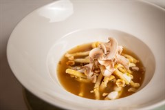 Passatello in brodo di funghi, taleggio e nocciole tostate